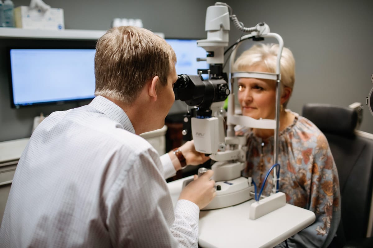 A eye doctor performing a Laser Eye Surgery Consultation